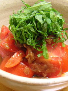 A picture of Tomatoes Dressed with Umeboshi Pickled Plums and Bonito Flakes.
