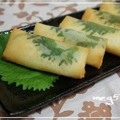 Spring Rolls Filled With Chicken Tenders and Cheese, Accented with Shiso A picture of Spring Rolls Filled With Chicken Tenders and Cheese, Accented with Shiso.