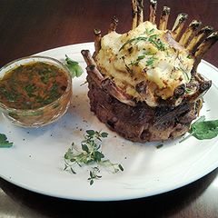 A picture of Crown Roast Rack of Lamb filled with Mashed Potatos.