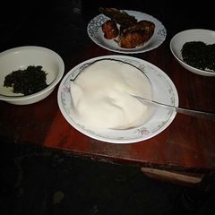 A picture of Ugali sukuma with fried fish.