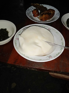 A picture of Ugali sukuma with fried fish.
