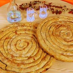 A picture of Zucchini Pie with Smoked Pork & Metsovone.