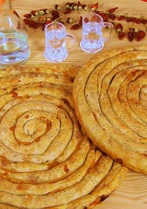 A picture of Zucchini Pie with Smoked Pork & Metsovone.