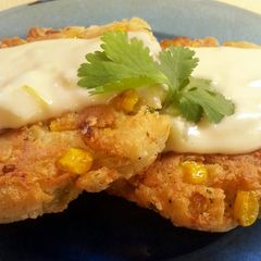 A picture of Mexican Corn Cakes with Green Chili Sauce.