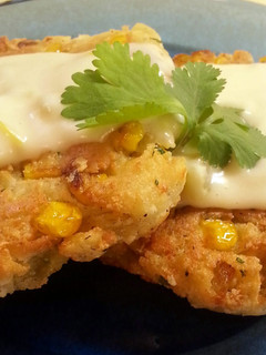 A picture of Mexican Corn Cakes with Green Chili Sauce.