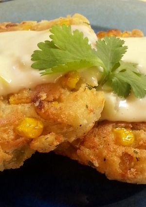A picture of Mexican Corn Cakes with Green Chili Sauce.