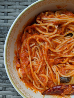 A picture of Spaghetti pasta in red sauce.