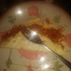 A picture of Homemade noodles and omelette.