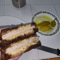 A picture of Fried Turkey and cheese sandwich on marble rye.