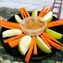 A picture of Apples and Carrot Sticks with Peanut Butter and Cream Cheese Dip.