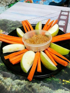 A picture of Apples and Carrot Sticks with Peanut Butter and Cream Cheese Dip.