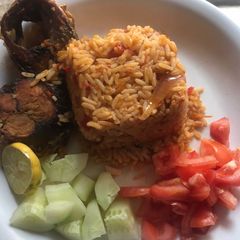 Fish, jollof rice and veggies A picture of Fish, jollof rice and veggies.