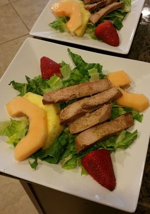 A picture of Fruit of land and sea dinner salad..