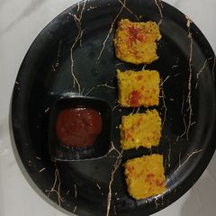 A picture of Steamed Corn Dhokla.