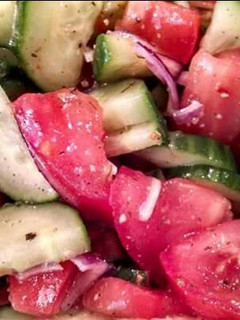 A picture of Tomato and Cucumber Salad.