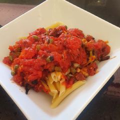 Pasta in spicy chorizo tomato sauce with capers A picture of Pasta in spicy chorizo tomato sauce with capers.