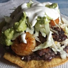 Shrimp and beef tostada A picture of Shrimp and beef tostada.