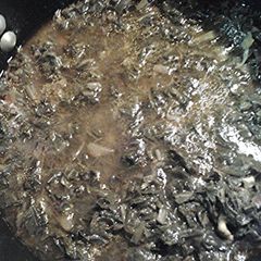A picture of Collards in chicken stock.