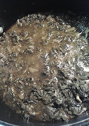 A picture of Collards in chicken stock.