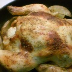 A picture of Roasted chicken with garlic lemon butter.