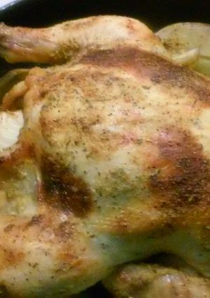 A picture of Roasted chicken with garlic lemon butter.