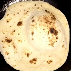 A picture of Wheat flour Naan on tawa.