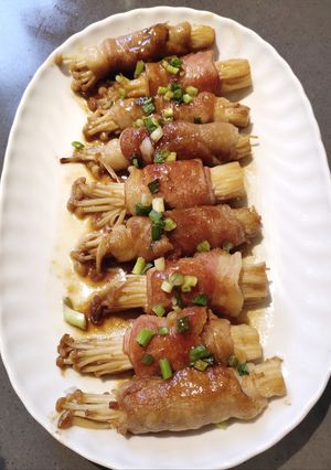 A picture of Enoki Mushroom Rolled with Bacon.