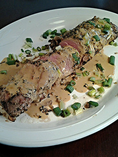 A picture of Sesame / Peanut Crusted Pork Tenderloin with Wasabi Cream Sauce.