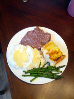 A picture of Venison steaks with red wine blue cheese sauce.