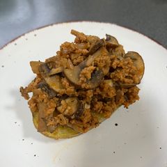 A picture of Stuffed Baked Potatoes with TVP and Mushrooms.