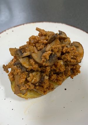 A picture of Stuffed Baked Potatoes with TVP and Mushrooms.