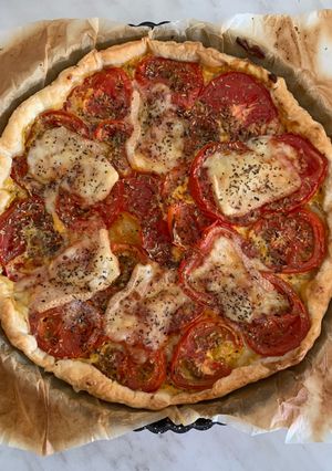 Une photo de Tarte tomates et fromage raclette