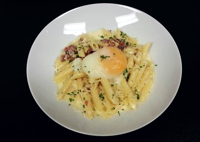 Penne' Pasta with back bacon white sauce and poached egg