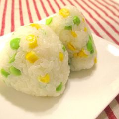 A picture of Two Kinds of Onigiri Rice Balls with Corn and Edamame Beans.