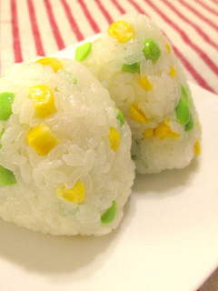 A picture of Two Kinds of Onigiri Rice Balls with Corn and Edamame Beans.