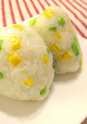 A picture of Two Kinds of Onigiri Rice Balls with Corn and Edamame Beans.