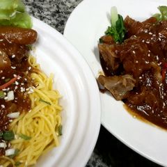 A picture of Kanya's Braised Pork Knuckles with BBQ sauce.