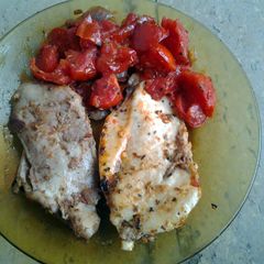 A picture of Chicken breasts with thyme and vegetables.
