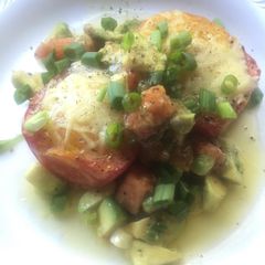 A picture of Eggs in Roasted Roma Tomatoes.