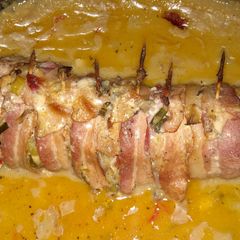 A picture of Bacon wrapped stuffed tenderloin.