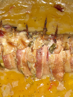 A picture of Bacon wrapped stuffed tenderloin.