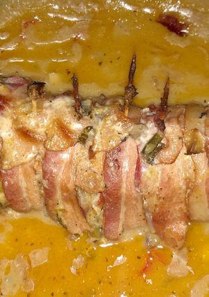 A picture of Bacon wrapped stuffed tenderloin.