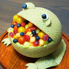 A picture of A Hungry Frog-Shaped Melon Bowl Dessert.