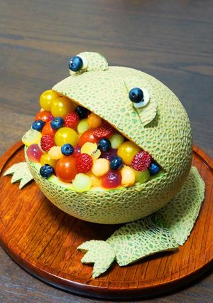 A picture of A Hungry Frog-Shaped Melon Bowl Dessert.