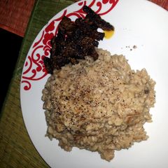 A picture of mushroom rizoto with krispy beef.