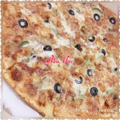 A picture of Chicken spicy Tikka Pizza.