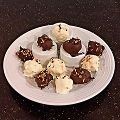 A picture of Cheesecake Balls, Covered in Dark Or White Chocolate.