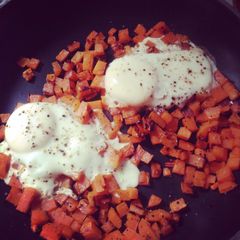 A picture of Sweet potato hashbrowns And eggs.