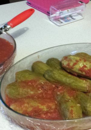 A picture of kusa bi banadoora (stuffed zucchini cooked in tomato).