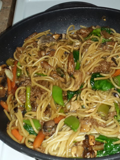 A picture of Vegetable stir fry with spaghetti.